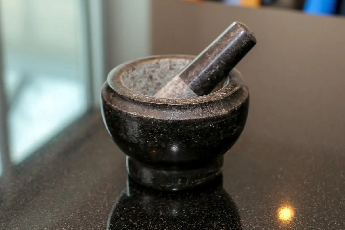Maca in Morocco: Energy, Libido & Weight Gain 19 Wooden mortar with maca root powder evoking traditional Andean preparation