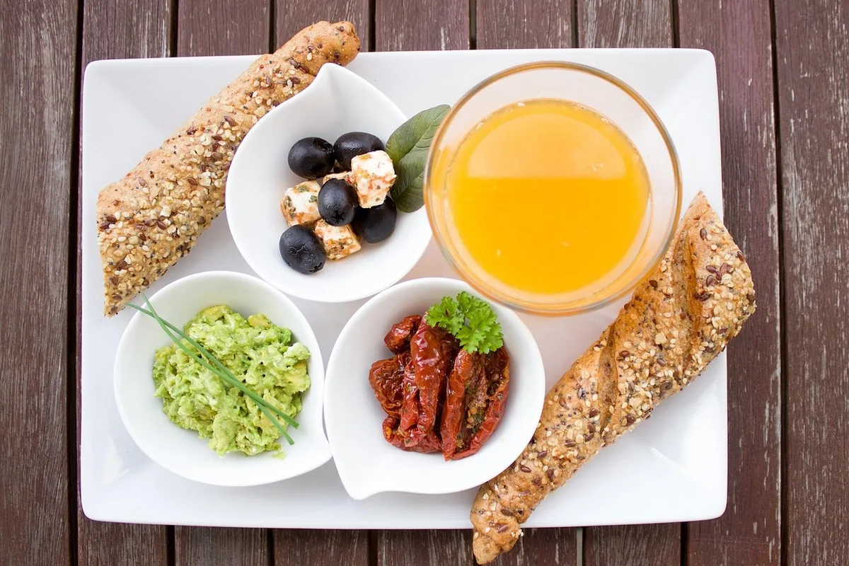 Vitamin B12 Deficiency in Morocco: Symptoms & Fatigue 11 Foods rich in vitamin B12: eggs, fish, liver and dairy products arranged on a table, animal sources of cobalamin