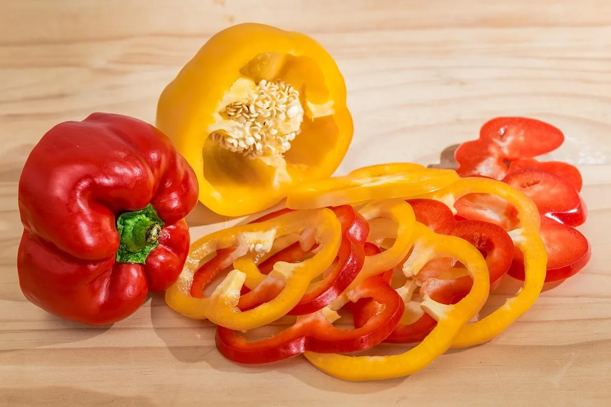 Red pepper cut in close-up — one of the foods richest in Vitamin C, surpassing the orange
